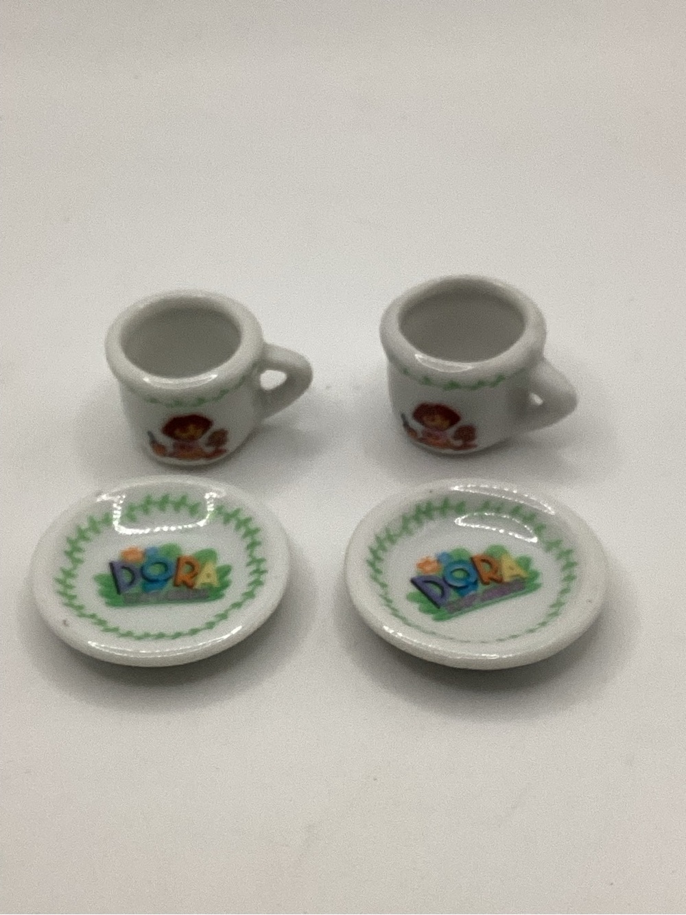 Miniature Dora the Explorer 2006 tea cups (2) and saucers (2)